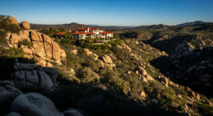 Inland North County San Diego hills with chaparral and granite outcroppings under a clear sky